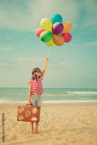 Happy child playing with toy airplane