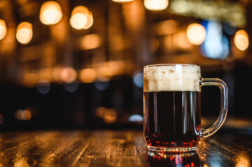 A glass of dark beer on counter