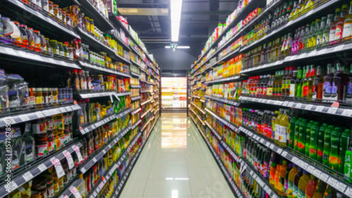 Fotomural Blurred Background Abstract Bokeh Shelving unit in Shopping store supermarket look at the lights