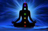 Silhouette of woman doing yoga and where has scored seven chakra points