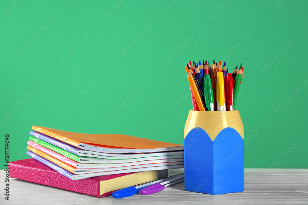 School stationery on green background