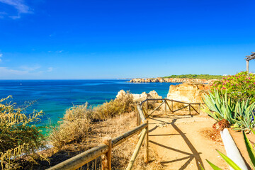 Wall Mural - walkway over beach Praia da Rocha in Portimao, Algarve, Portugal