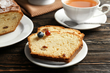 Sticker - Saucer with slices of yogurt cake and berries on wooden table