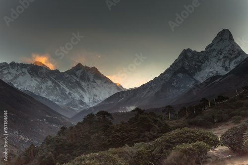 Sunrise in Himalayas. Ama Dablam, Nuptse, Lhotse and Everest in first rays of sun. Two eight-thousander peaks. View from Tengboche. Sagarmatha National Park, Solukhumbu District in Nepal, Asia. 