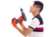 © Dmitry Bairachnyi - Young man with gloves and glasses holding electric screwdriver