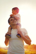 © guas - Happy father and little child son walking at sunny day, family photo on a sunset