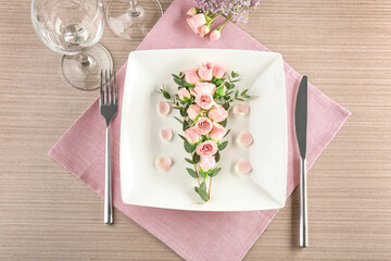 Wall Mural - Beautiful festive table setting with floral decor on wooden surface