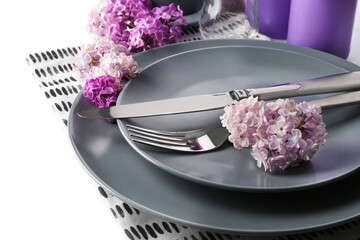 Wall Mural - Beautiful festive table setting with lilac flower decor on white background, closeup