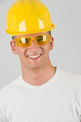 Worker with hard hat smiling