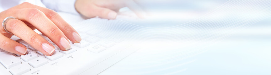 Aufkleber - Hands typing on computer keyboard.