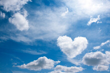 Heart Cloud On Blue Sky Background. Weather Or Love Abstract Symbol  With Space For Text