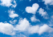 Heart White Cloud On Blue Sky Background. Weather Or Love Abstract Symbol