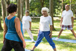© Photographee.eu - Seniors doing yoga with an instructor