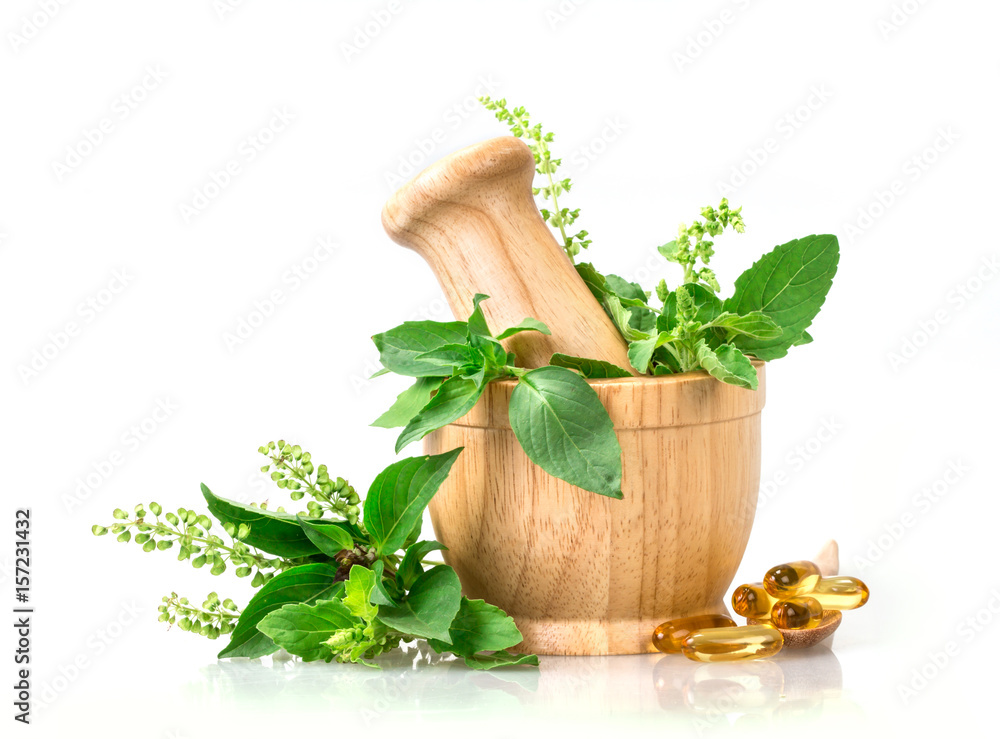 Sweet basil and hot basil in wooden mortar with essential oil and supplement, alternative herbal medicine concept - obrazy, fototapety, plakaty 