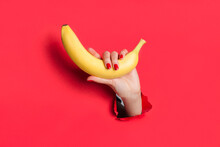 Crop Hand Holding Banana