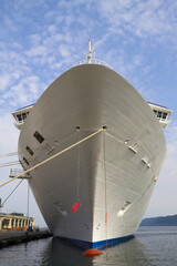 Cruise ship bow - moored along the dock - front view.