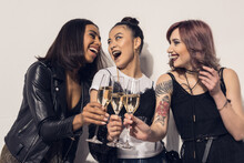 Young Happy Multiethnic Girls Drinking Champagne At Party