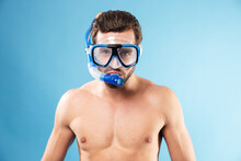 Portrait Of A Young Man Wearing Swimming Mask And Snorkel