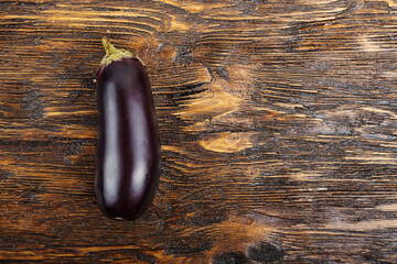 one eggplant on a wooden table