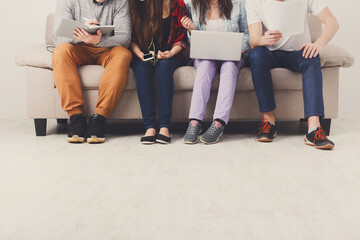 Casual business people working with gadgets indoor