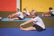 © WavebreakMediaMicro - Portrait of happy schoolkid performing stretching exercise