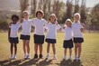 © WavebreakMediaMicro - Portrait of happy schoolgirls standing with arms around in park