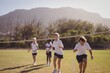 © WavebreakMediaMicro - Schoolgirls running toward finishing line