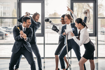 young multicultural business teams yelling and quarreling in office