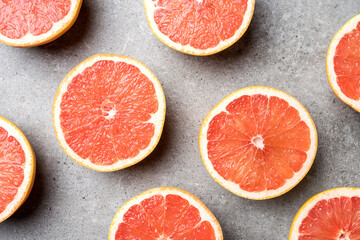 Poster - Red grapefruits on stone background