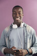 © santypan - Handsome african man using mobile.