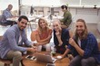 © WavebreakMediaMicro - Portrait of smiling business colleagues working at office