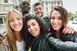 © javiindy - Multiracial group of young people taking selfie