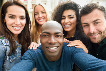 Multiracial group of young people taking selfie