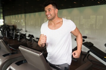 Wall Mural - Fitness Man Exercising On A Treadmill