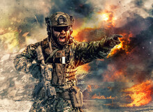 Bearded Soldier Of Special Forces In Action Pointing Target And Giving Attack Direction. Burnt Ruins, Heavy Explosions, Gunfire And Smoke Billowing On Background