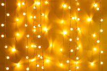 Blurred Retro Light Bulb Decor Glowing For Abstract Background. Holiday Or Party Background.
