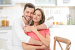 © Africa Studio - Young couple embracing at kitchen