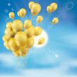 Goldene Luftballons vor einem blauen Himmel