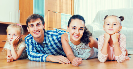 Wall Mural - Relaxed family in domestic interior