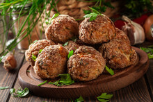 Stack Of Baked Meatballs On A Chopping Board