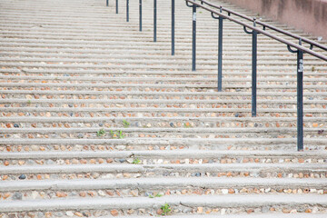 Old damaged stone staircase, up and down, textured background