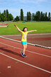 © denys_kuvaiev - Little girl have fun on the stadium