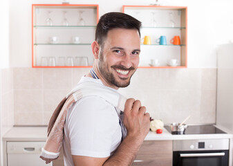 Portrait of handsome man in kitchen