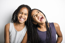 Adorable African Twin Little Girls On Studio Gray Background