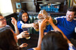 © Syda Productions - football fans clinking beer glasses at sport bar