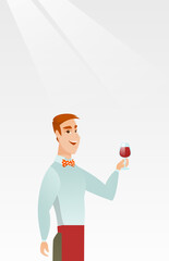 Wall Mural - Bartender holding a glass of wine in hand.