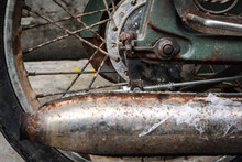 Rear Wheel And Rusty Exhaust Of A Vintage Motorbike Grungy Style