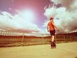 © rdonar - Vintage tone filter effect color style. Sportsman  with inline skates ride in summer park