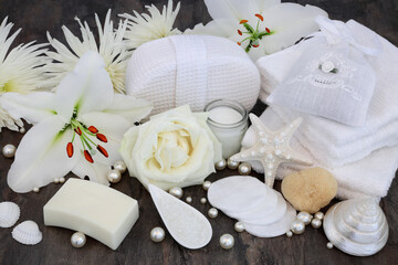 Sticker - Rose and white lily flower cleansing skincare beauty treatment including moisturising cream, soap, flannels, salt, natural sponge with shells and pearls.