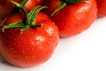 Red fresh tomatoes isolated on white background